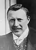 Middle-aged man wearing a tie, waistcoat and jacket.